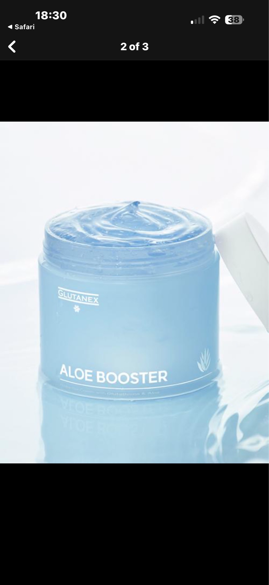 Blue cosmetic jar labeled “Aloe Booster” with a swirl of cream on top