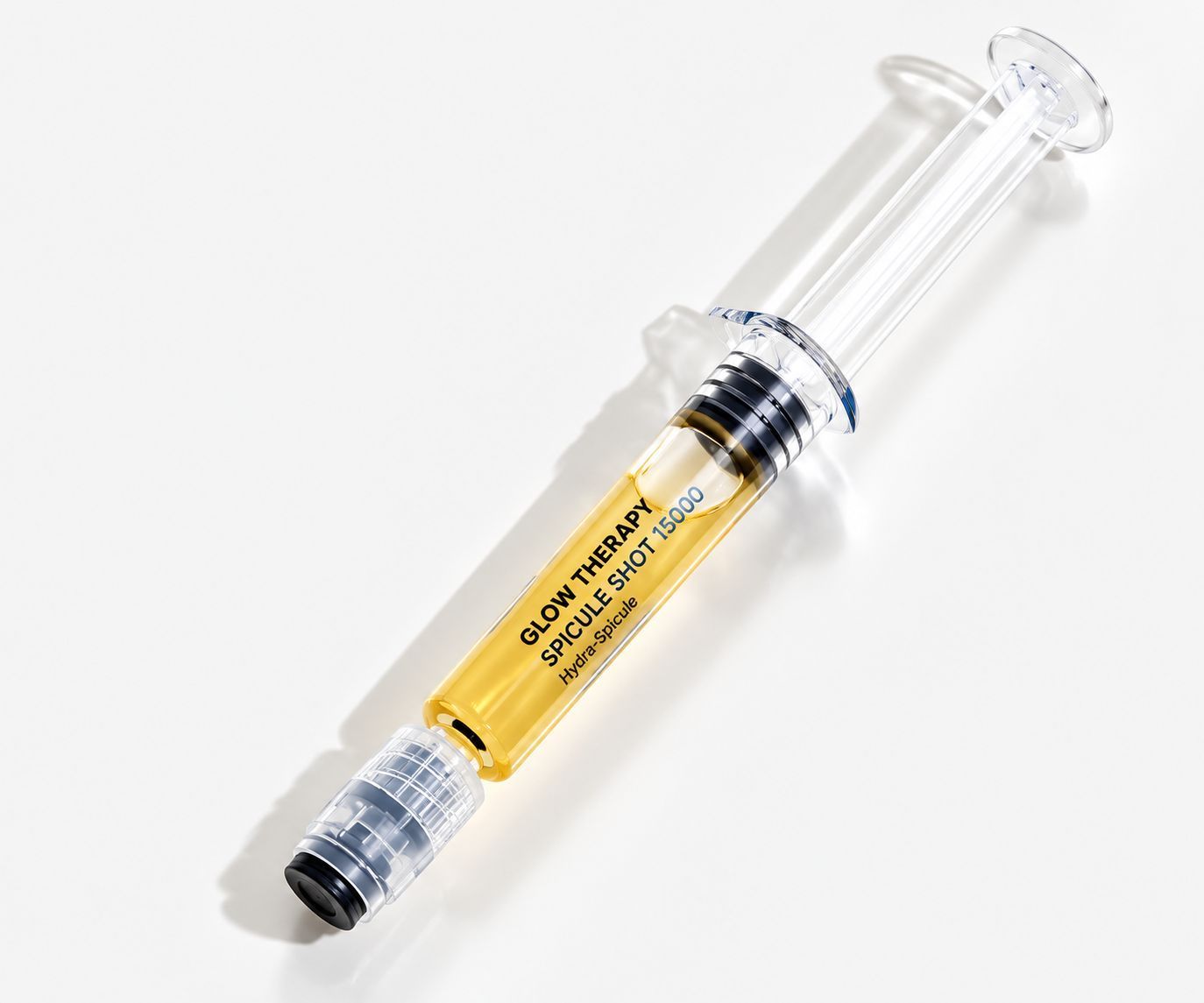 Clear syringe with yellow medication on a white background