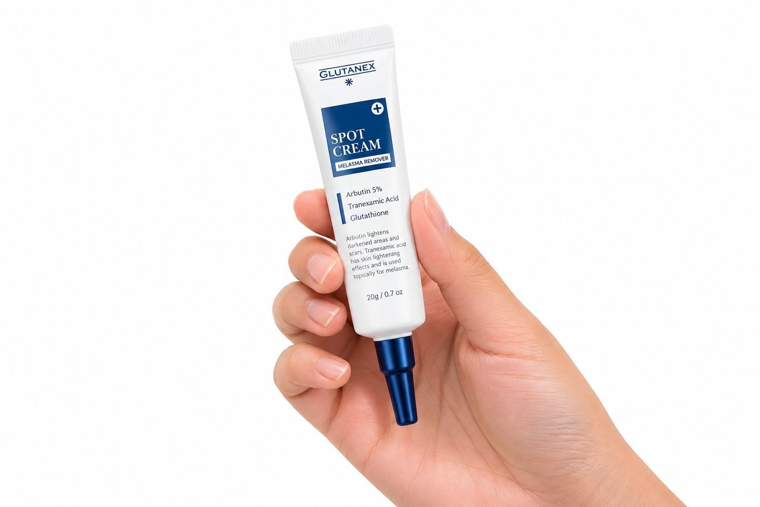 Hand holding a white tube of skincare cream with a blue cap on a white background