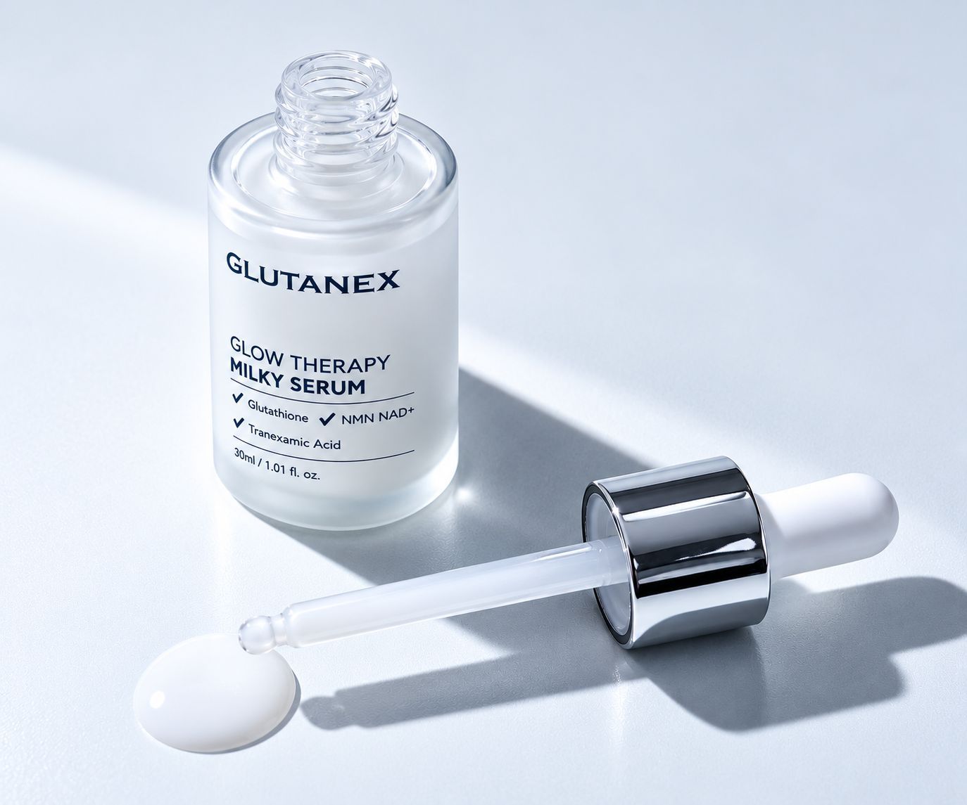 GLUTANEX skincare serum bottle and dropper with white liquid on a light background