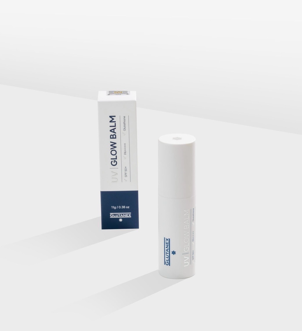 White skincare bottle and matching box on a light gray background.