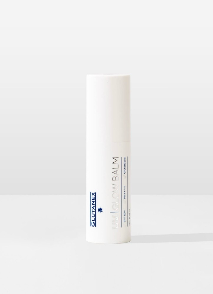 White cylindrical cosmetic tube with a silver cap on a light gray background