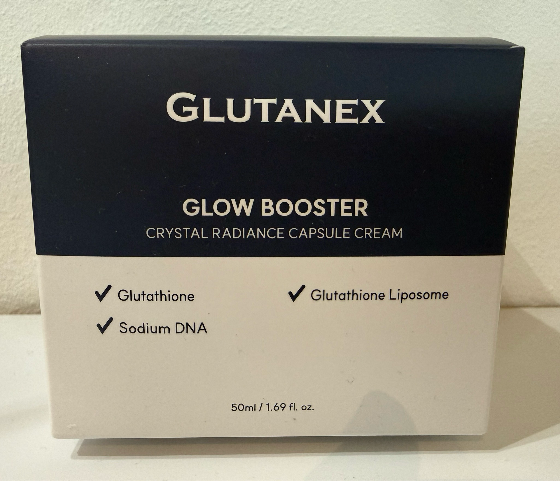 GLUTANEX Glow Booster crystal radiance capsule cream box, black and cream packaging with product details.