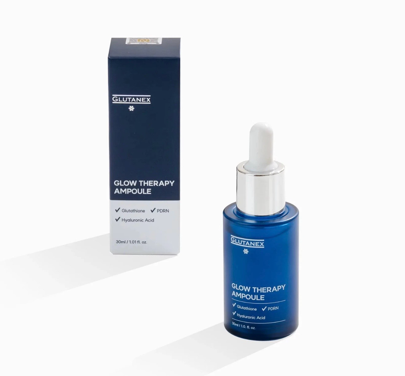 Blue glow therapy ampoule bottle with dropper beside matching box on white background