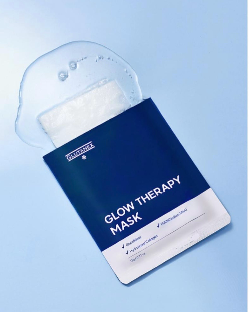 Blue-and-white Glow Therapy Mask face sheet packaging on a light blue background