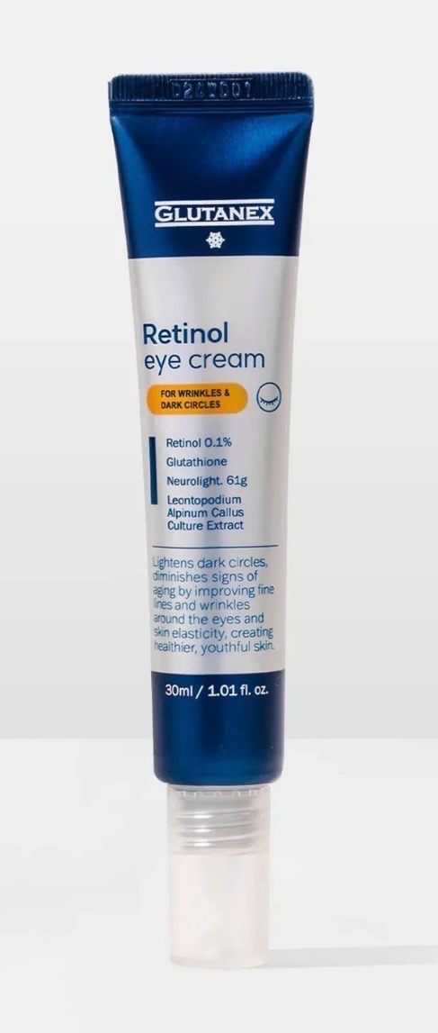 Blue-and-white retinol cream tube standing upright on a white background