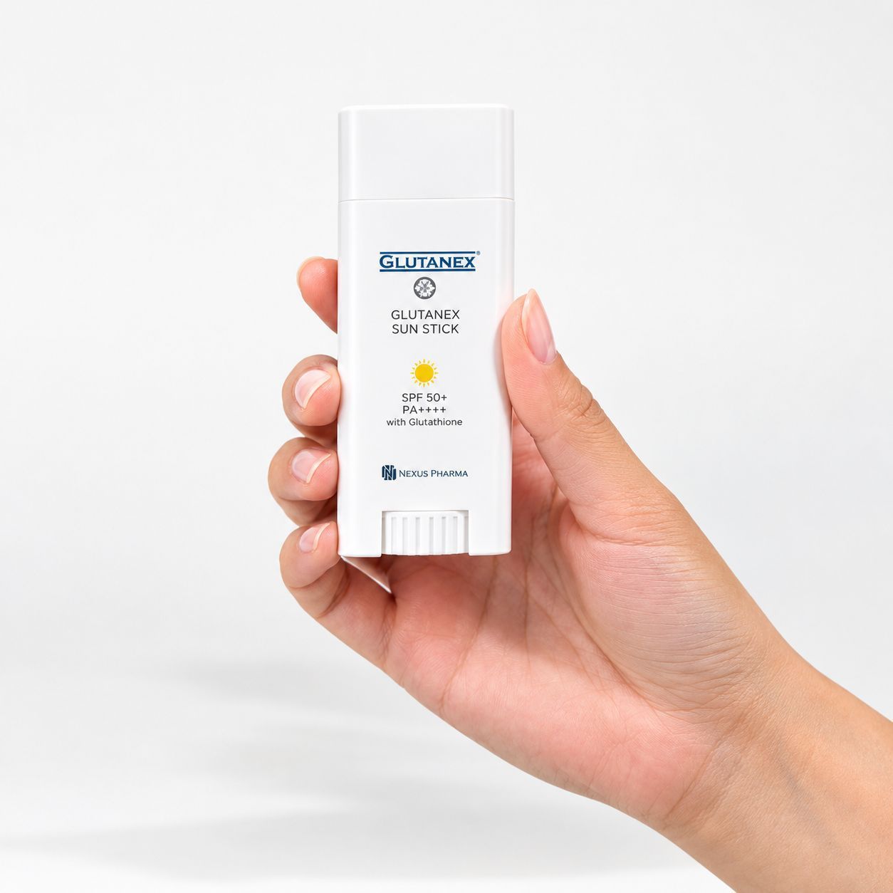 Hand holding a white cylindrical product with blue logo on a light background