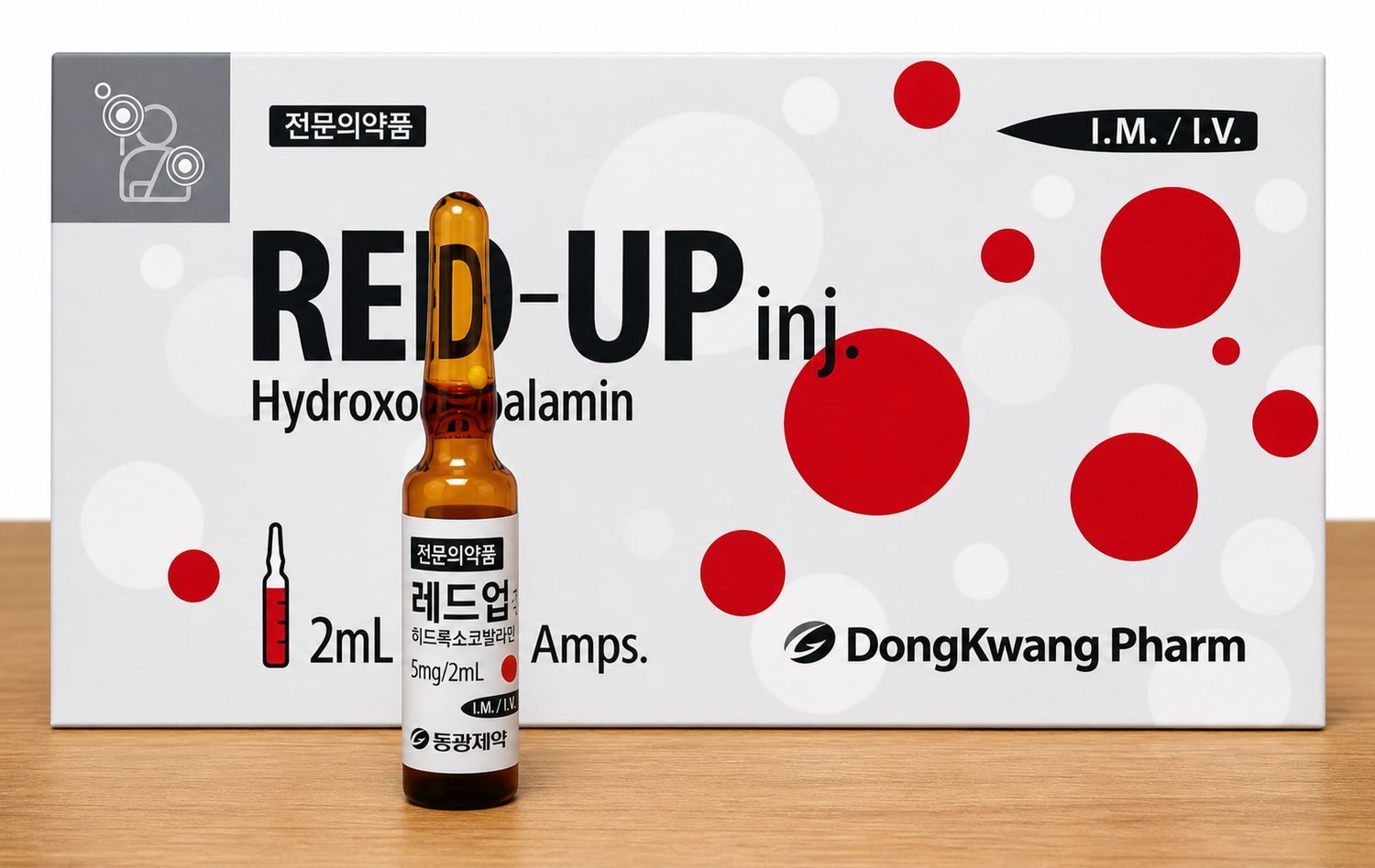 Red-UP inj. Hydroxocobalamin ampoules box with red circles and a vial on a wooden surface