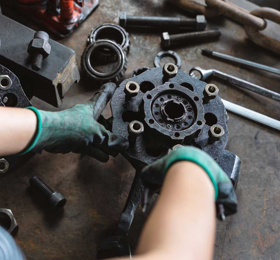 mechanic engineer inspecting and repairing vehicle auto parts