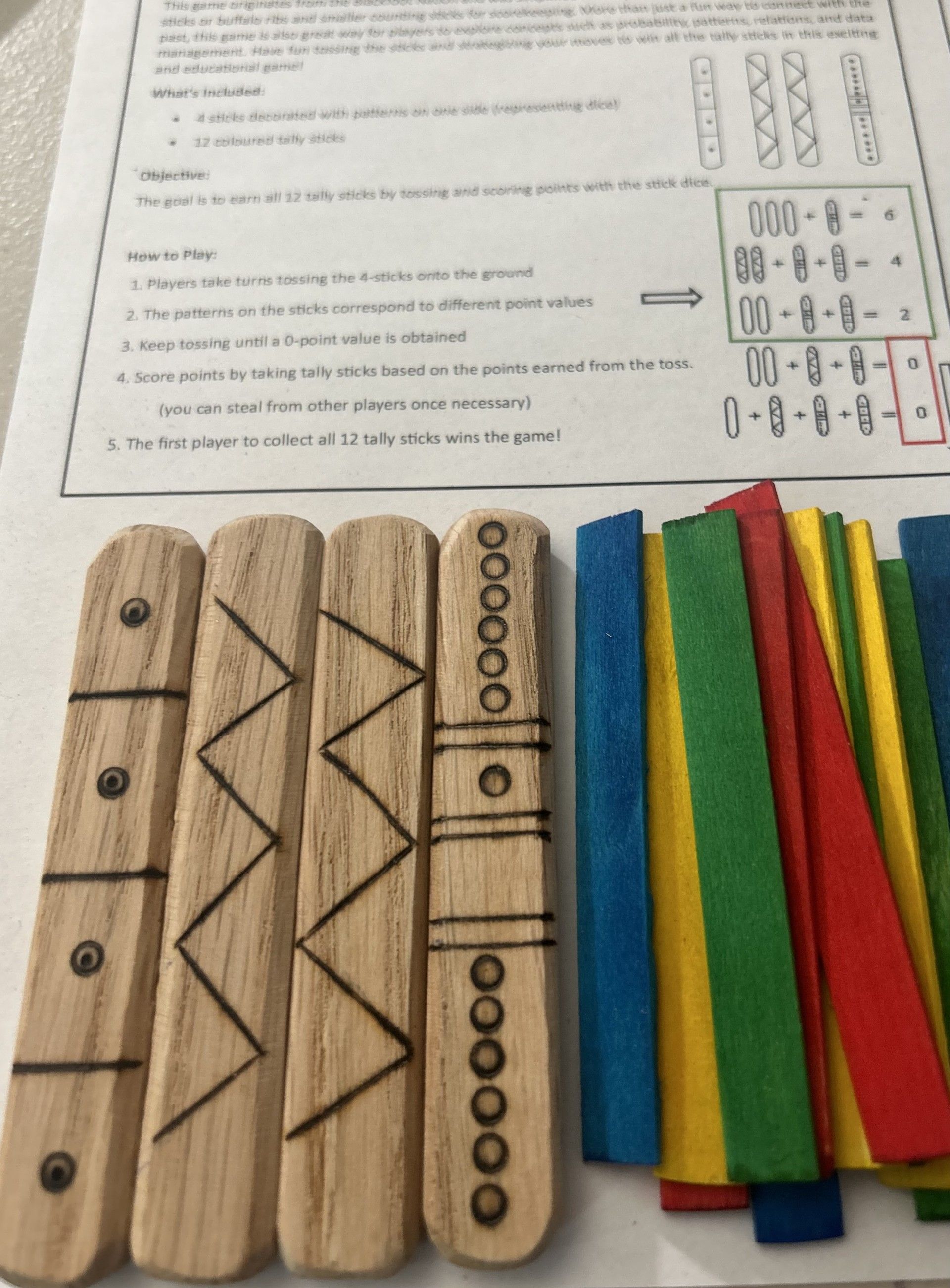 Handcrafted Traditional Blackfoot Stick Game used for cultural education & connection.