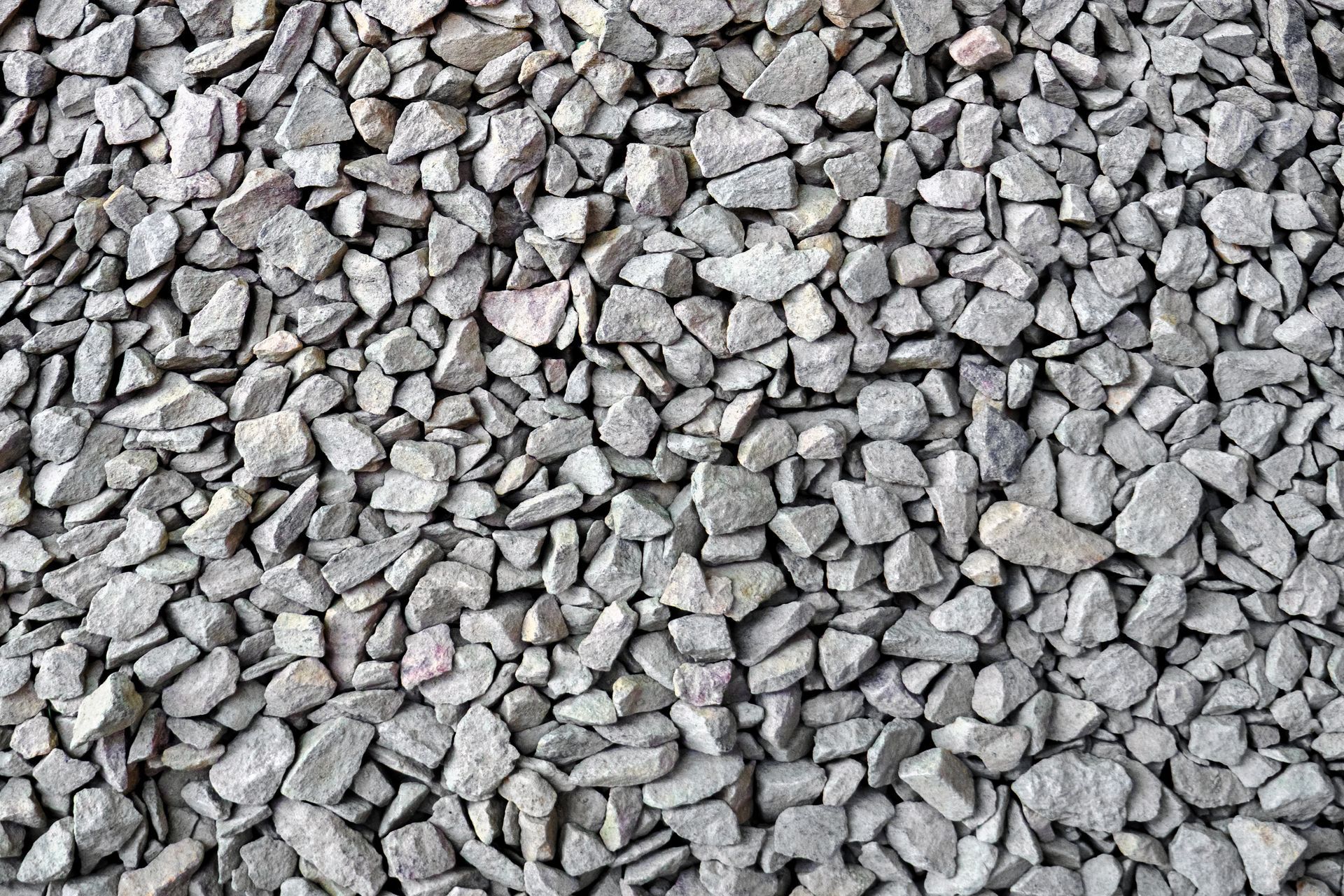 A pile of gravel is sitting on the ground.