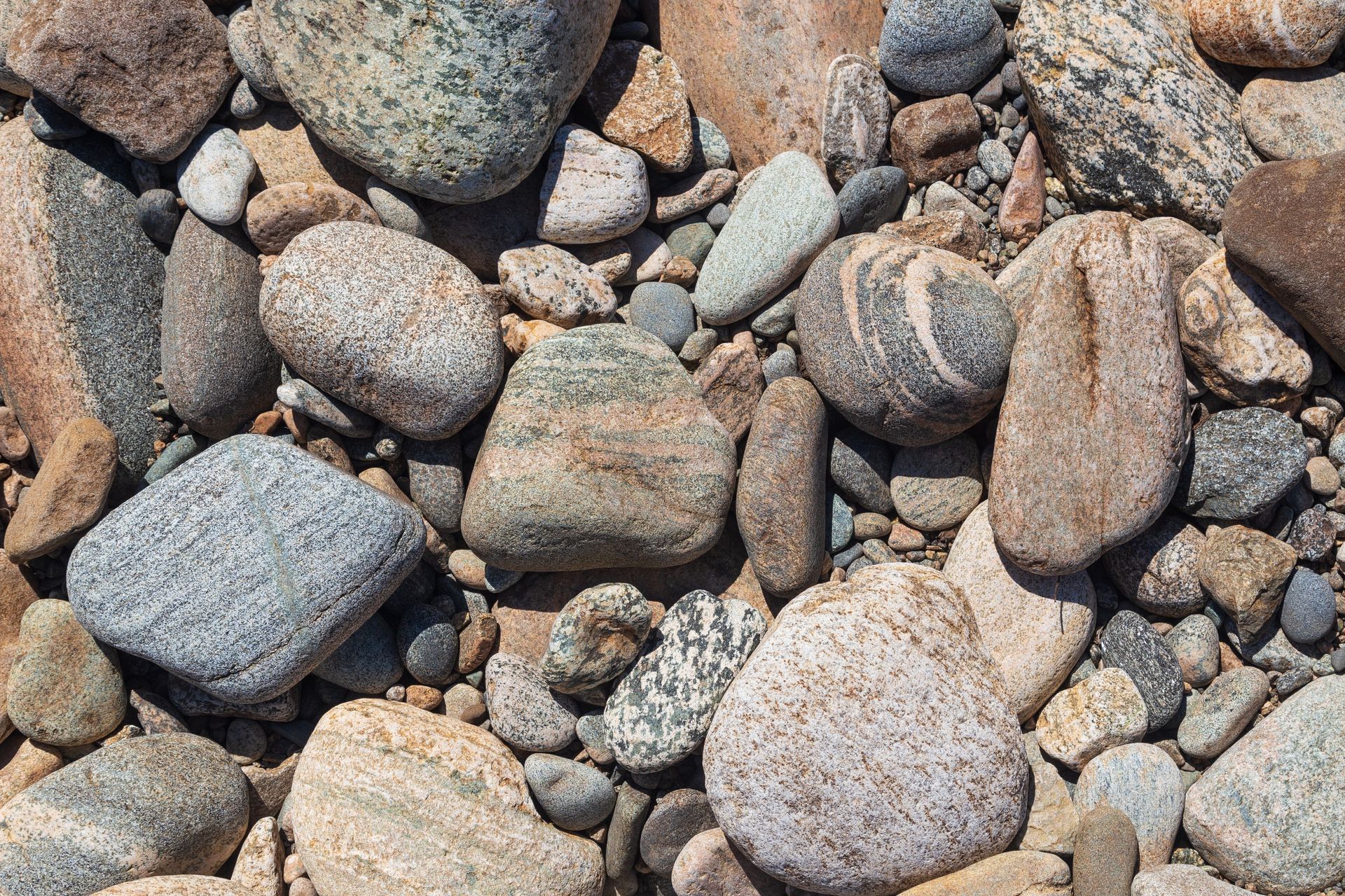 A pile of rocks is laying on the ground.