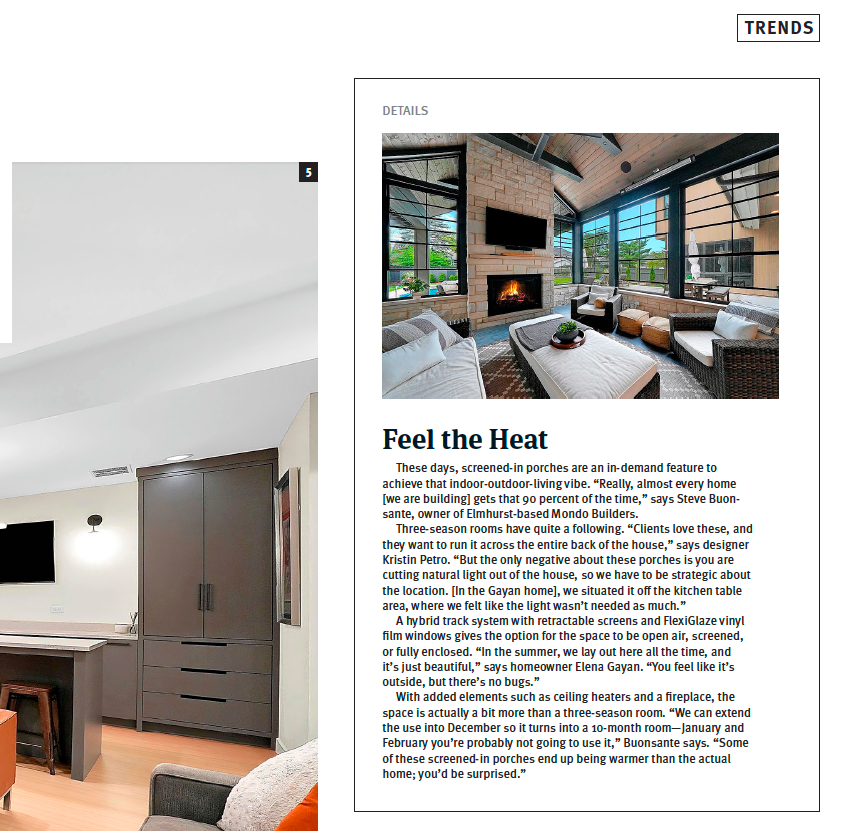 Magazine page about a modern living room with fireplace and large windows, titled “Feel the Heat”