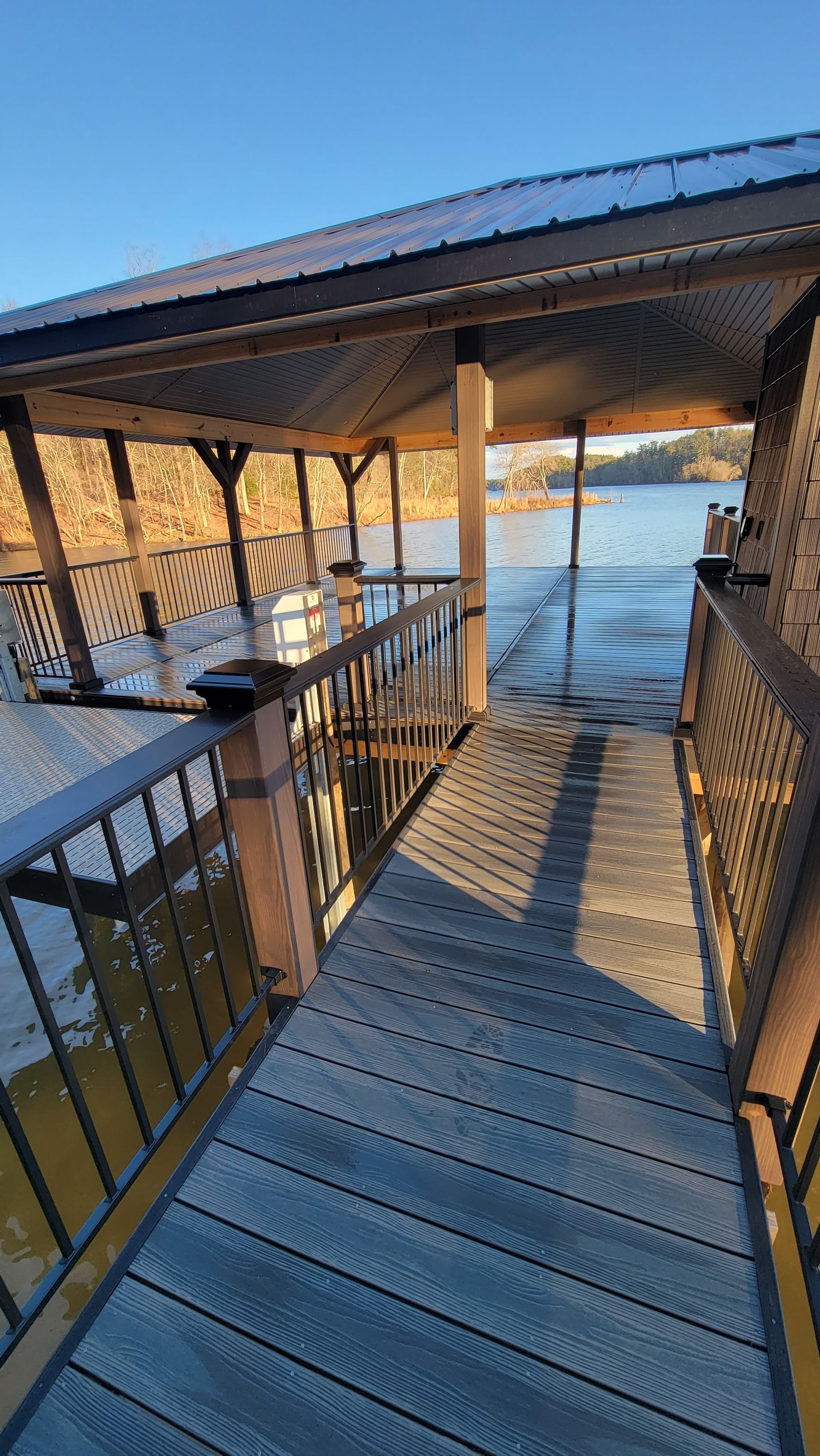 A before picture of a flooded area with a house in the background