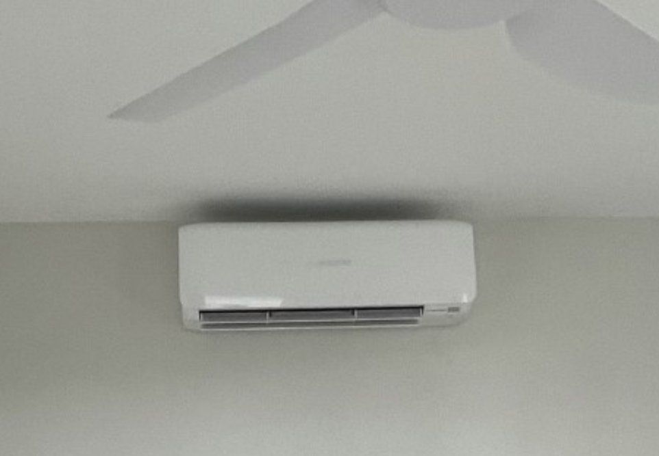 Repair Man Checking Air Conditioner — Sunshine Coast, QLD — Tedlec