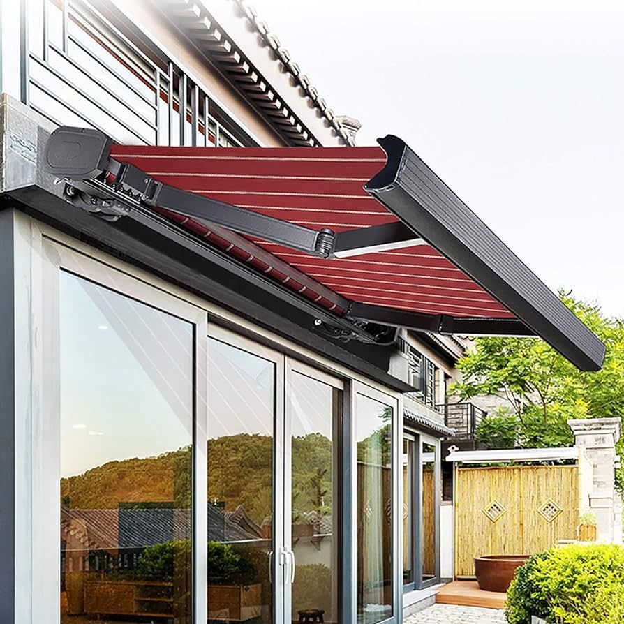 A house with a red awning on the side of it.