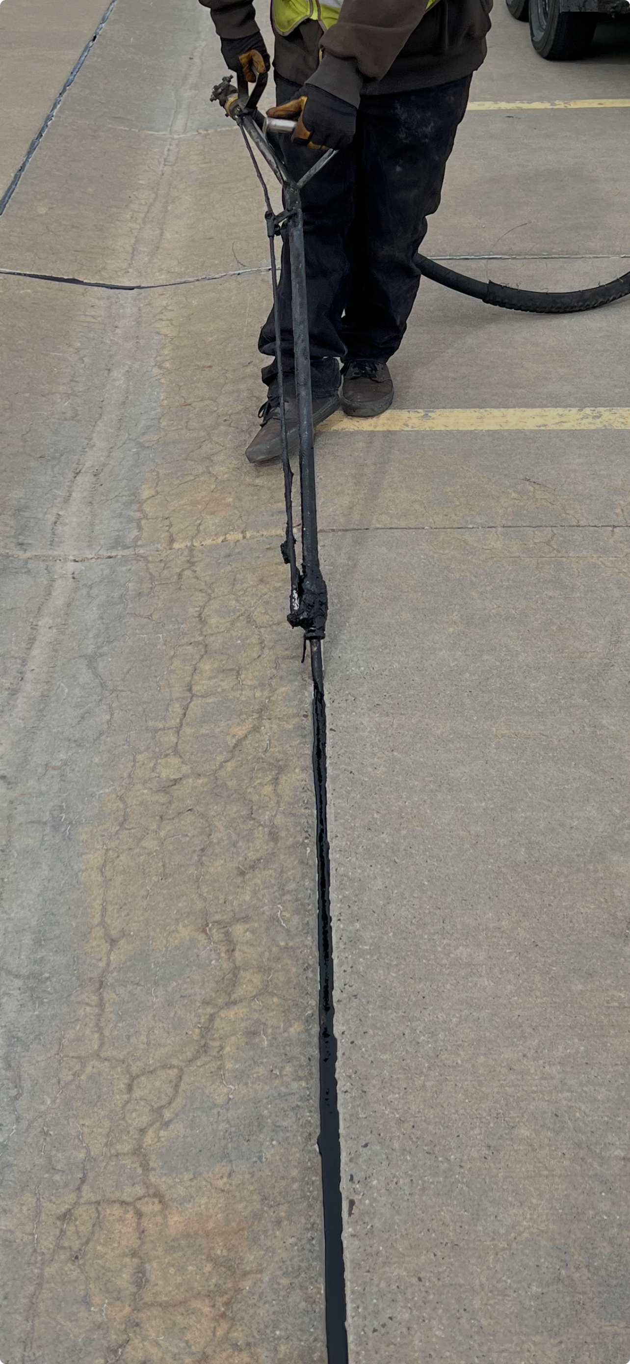 Shadow of a person holding a leash on sunlit pavement