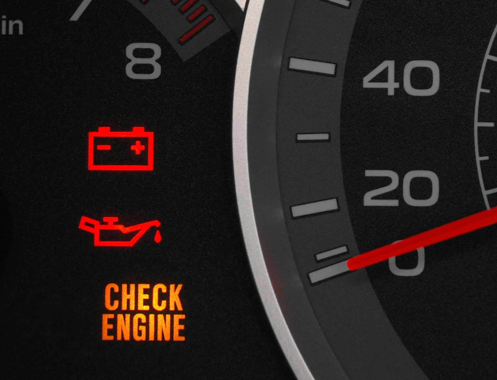 A close up of a car dashboard that says check engine