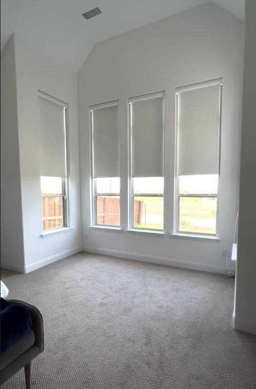 a bedroom with a lot of windows and shades on them Improve lighting and insulation window treatment automations Love is Blinds Kentucky (859) 549-3177.
