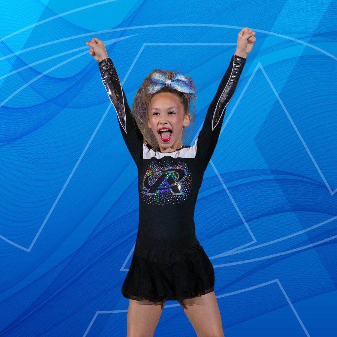 A little girl wearing a black top with the letter r on it