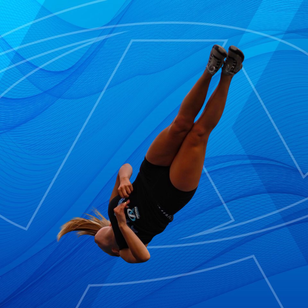 A person is doing a handstand in a field.