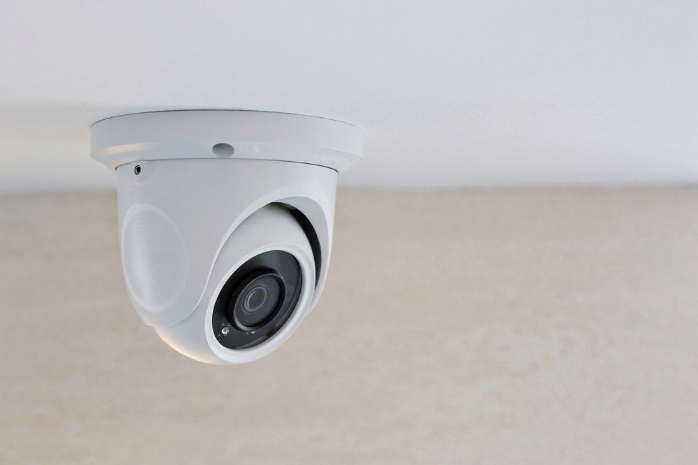 White Security Camera Mounted On A White Ceiling — Aliance Group in Macksville, NSW