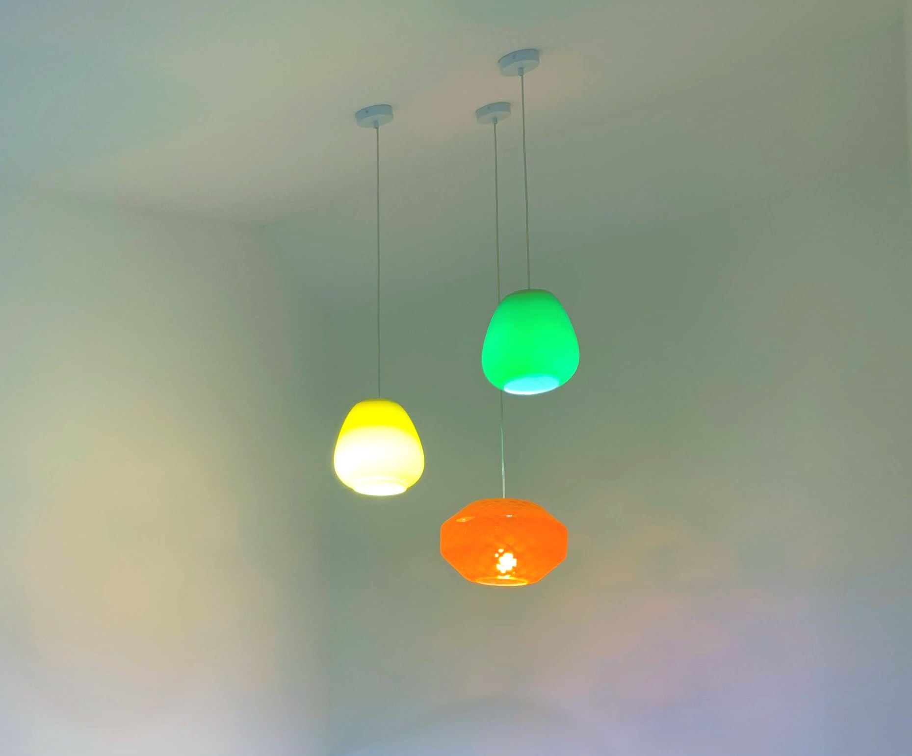 A Group of Three Pendant Lights in Red, Yellow, and Green — Aliance Group in Bonville, NSW