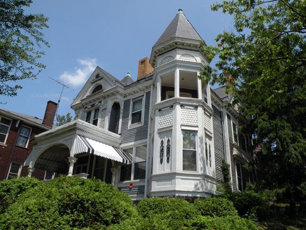 A large house with a tower on top of it