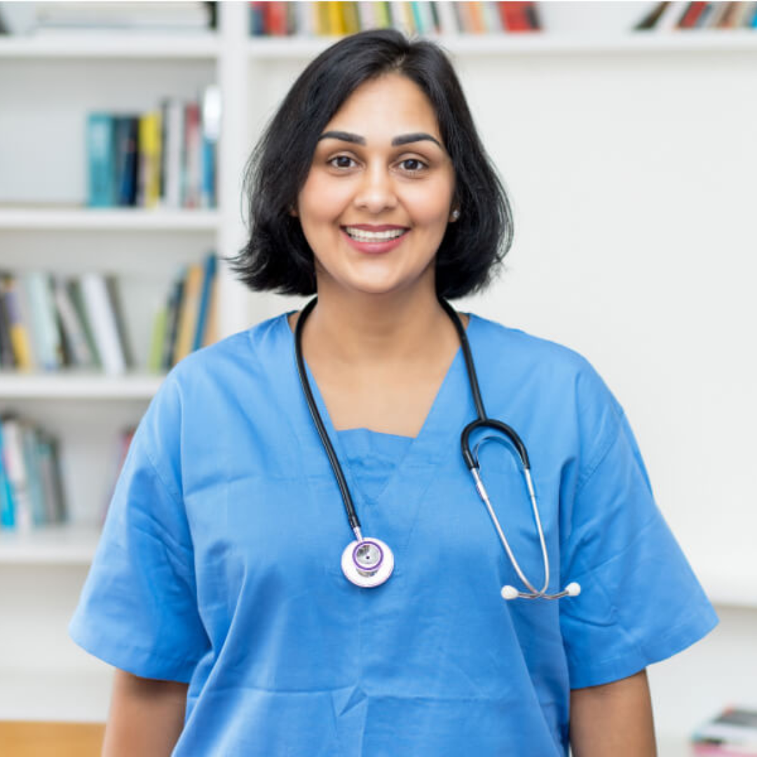 A female doctor wearing a blue scrub and a stethoscope around her neck