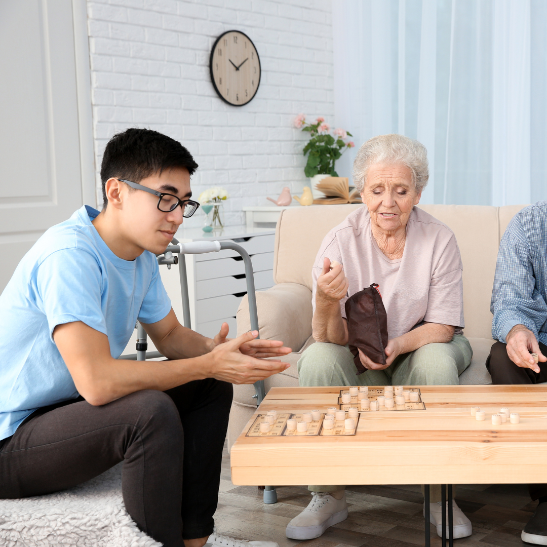 A group of people are sitting around a table playing a game.