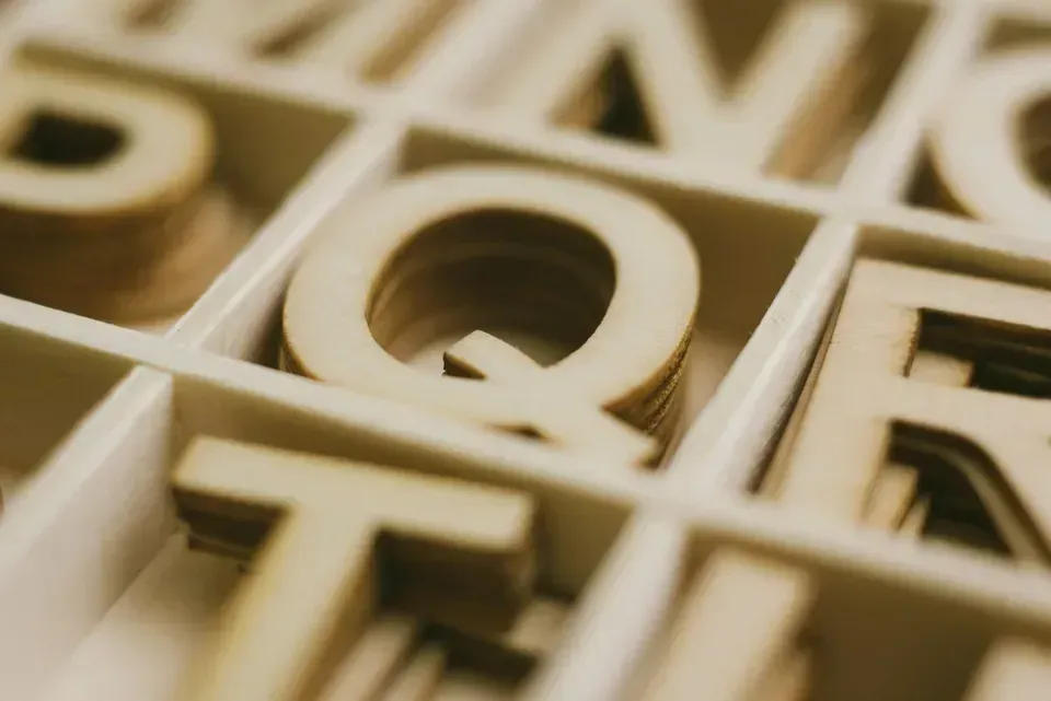 A Box Filled with Wooden Letters — Action Physiotherapy in Cooks Hill, NSW