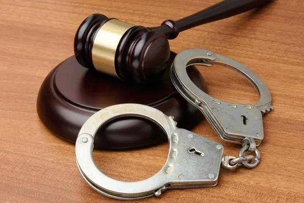 Hand Cuffs and Wooden Gavel