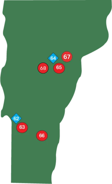 A green map of Vermont with two red circles on it.