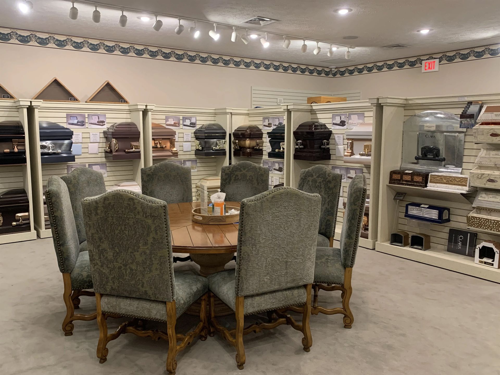 there is a table and chairs in the middle of the room .