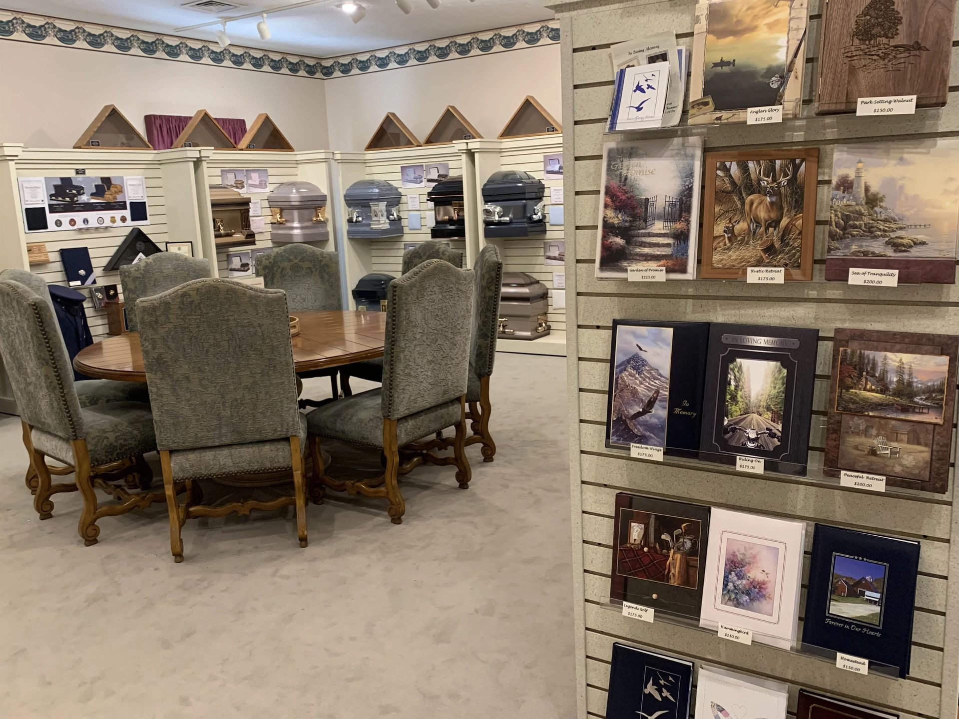 there is a table and chairs in the middle of the room .