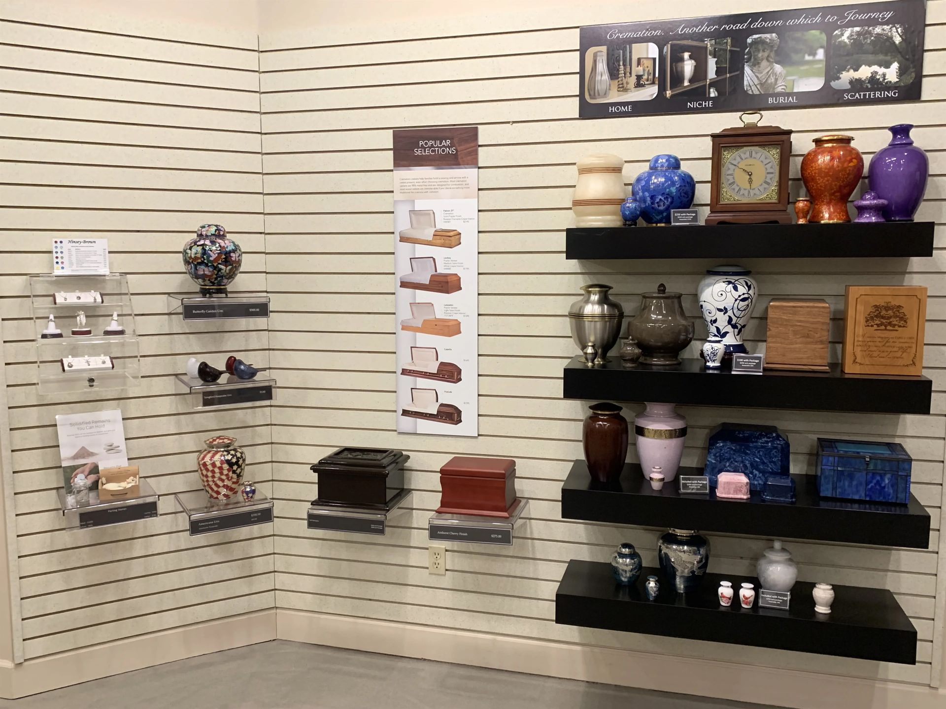 a room filled with shelves filled with vases and urns .