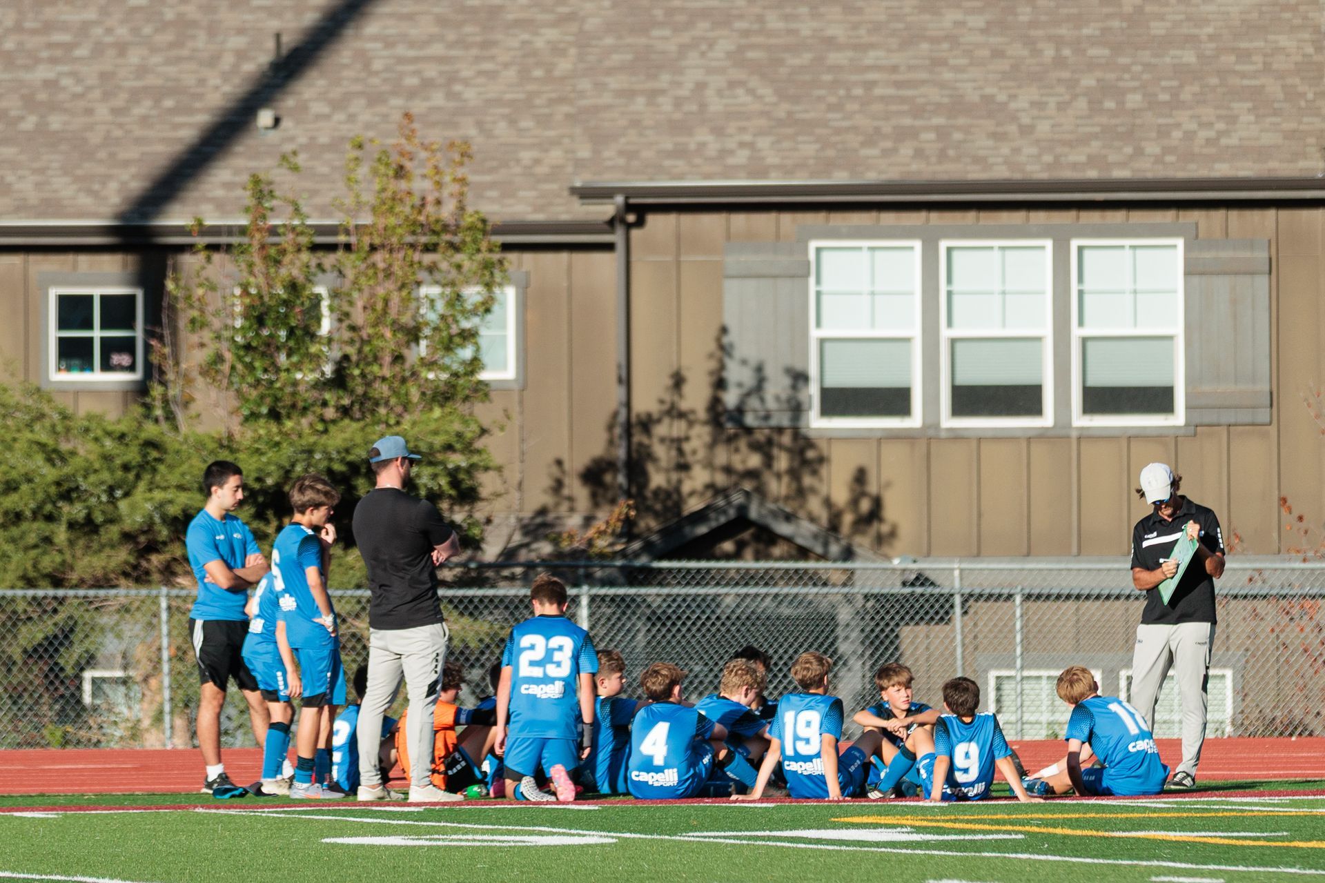 LFA soccer coach Rick talks the U15 boy's soccer team during half-time at Max Marr Stadium in Berthoud, Colorado