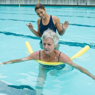 A swimming pool with a metal ladder in it