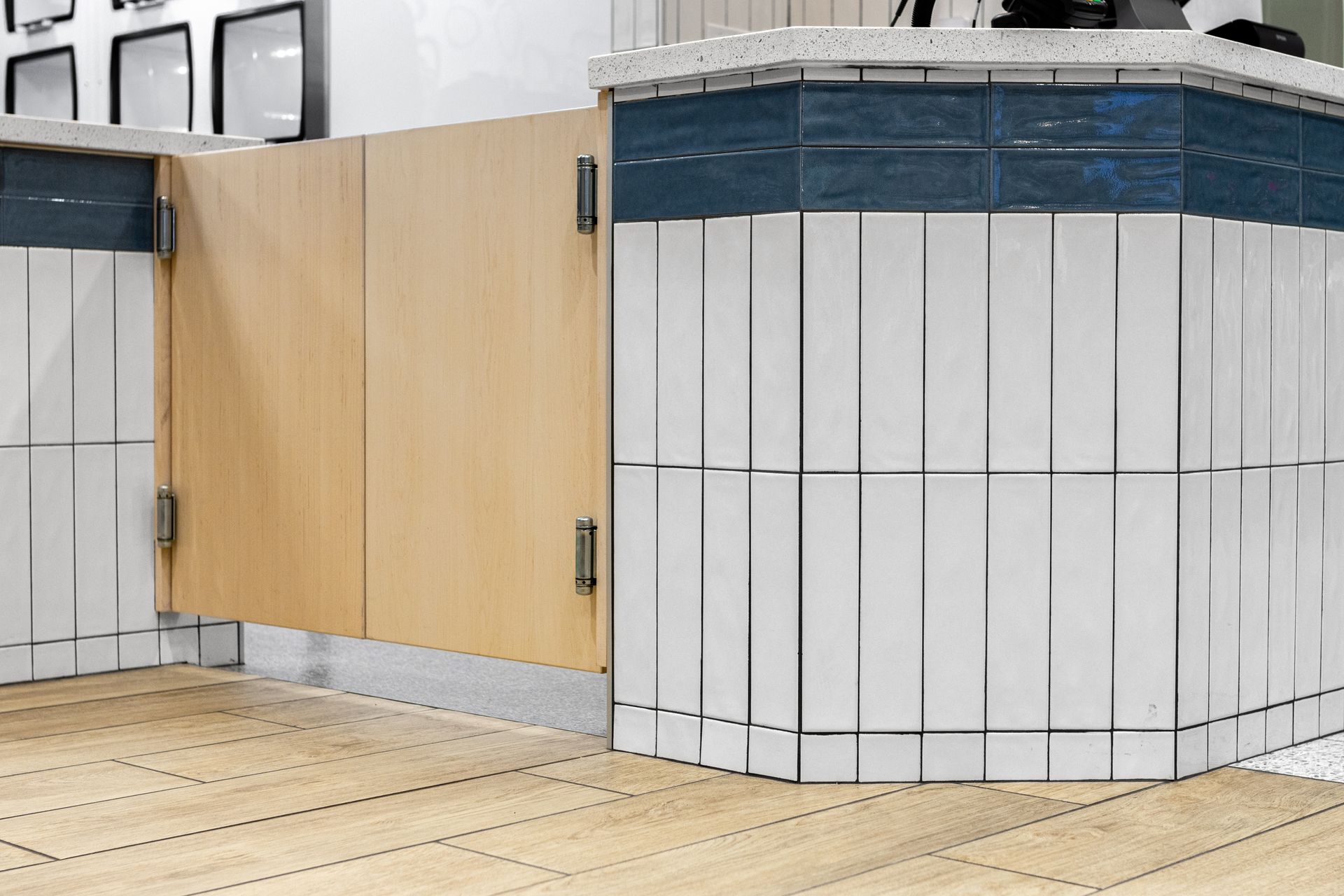 Penn State Cow & Cookie's wood door and white paneling in a tiled indoor area