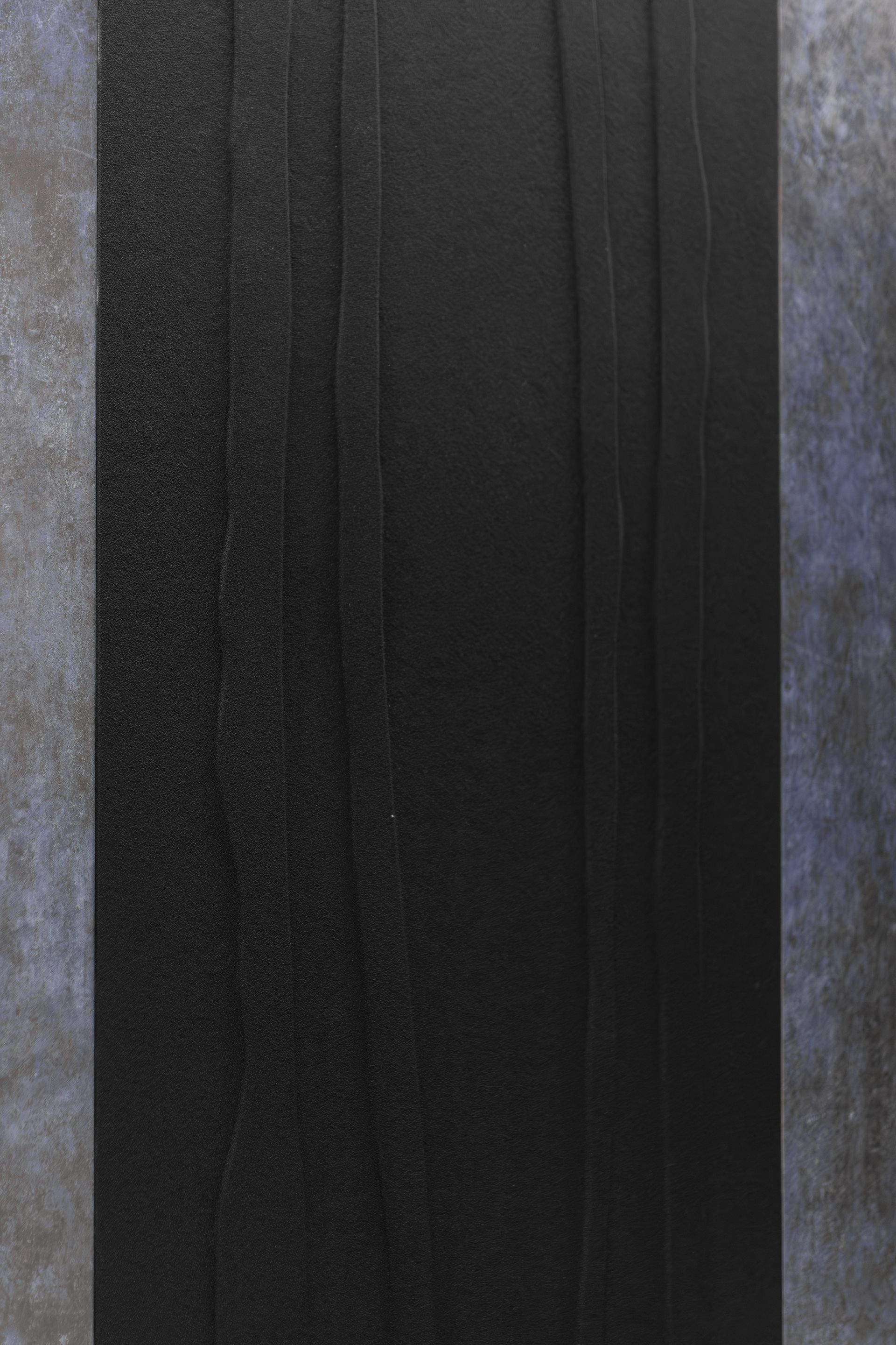 Bryce Jordan Center's dark vertical striped fabric or panel with gray-blue edges
