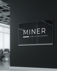 Miner Family Insurance sign on a dark wall in a modern office interior