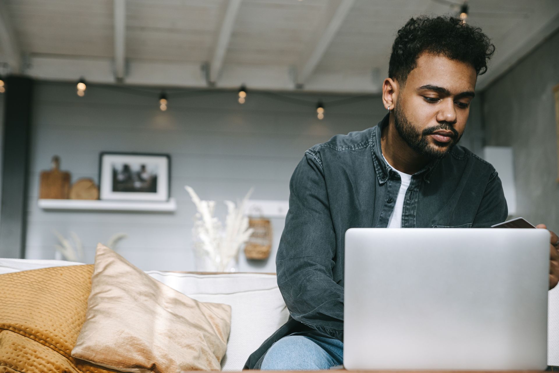 Homeowner comparing quotes and homeowners insurance discounts on a laptop