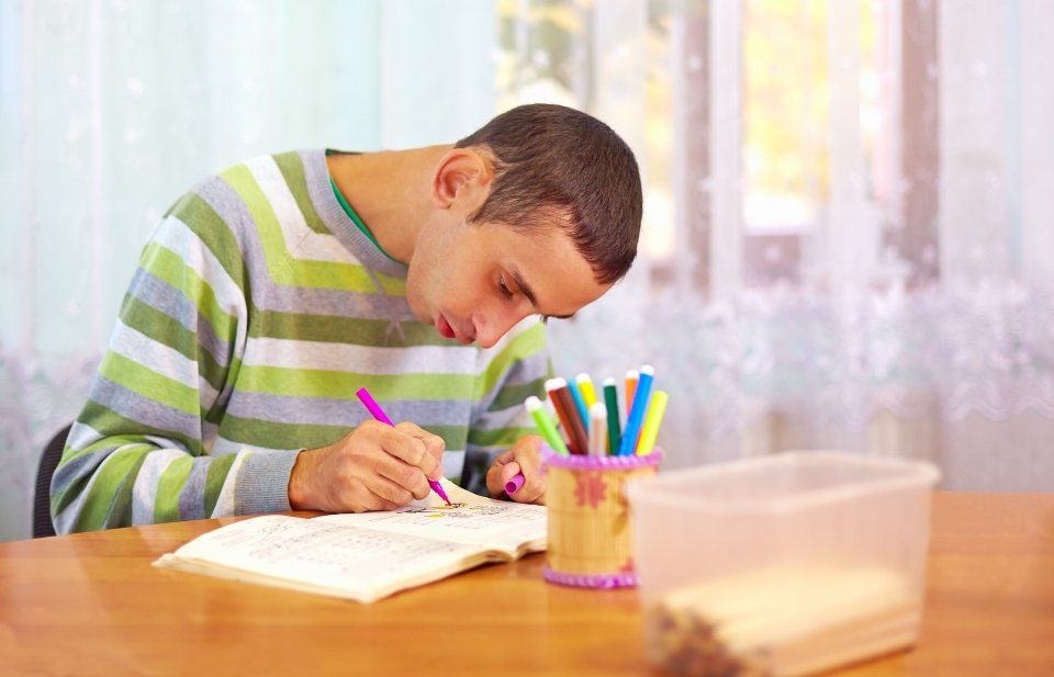 boy trying to write