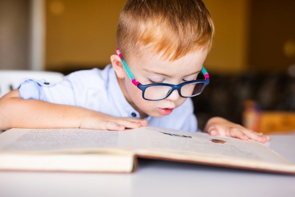 boy trying to read