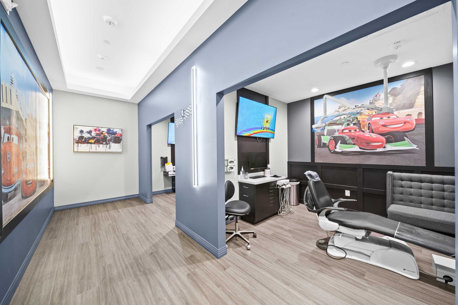 Grand Prix Dental in Katy, TX A dental office with a dental chair and a desk.
