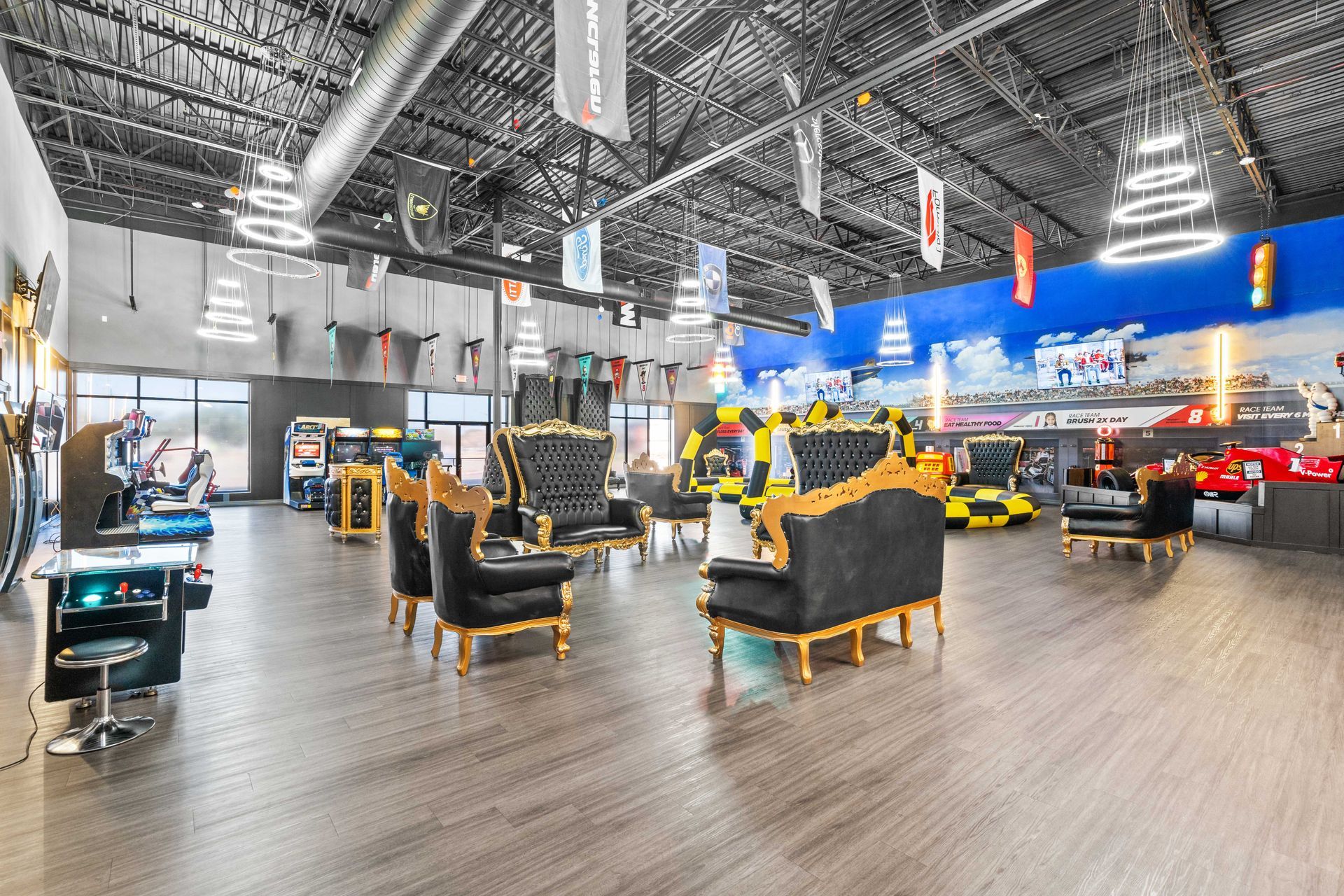 Grand Prix Dental in Katy, TX A large room with a lot of furniture and arcade games.
