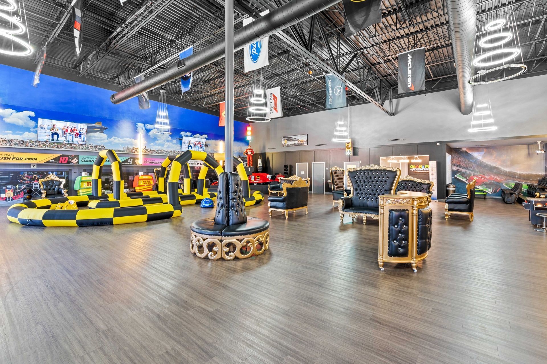 Grand Prix Dental in Katy, TX A large room with a lot of furniture and a go kart track.