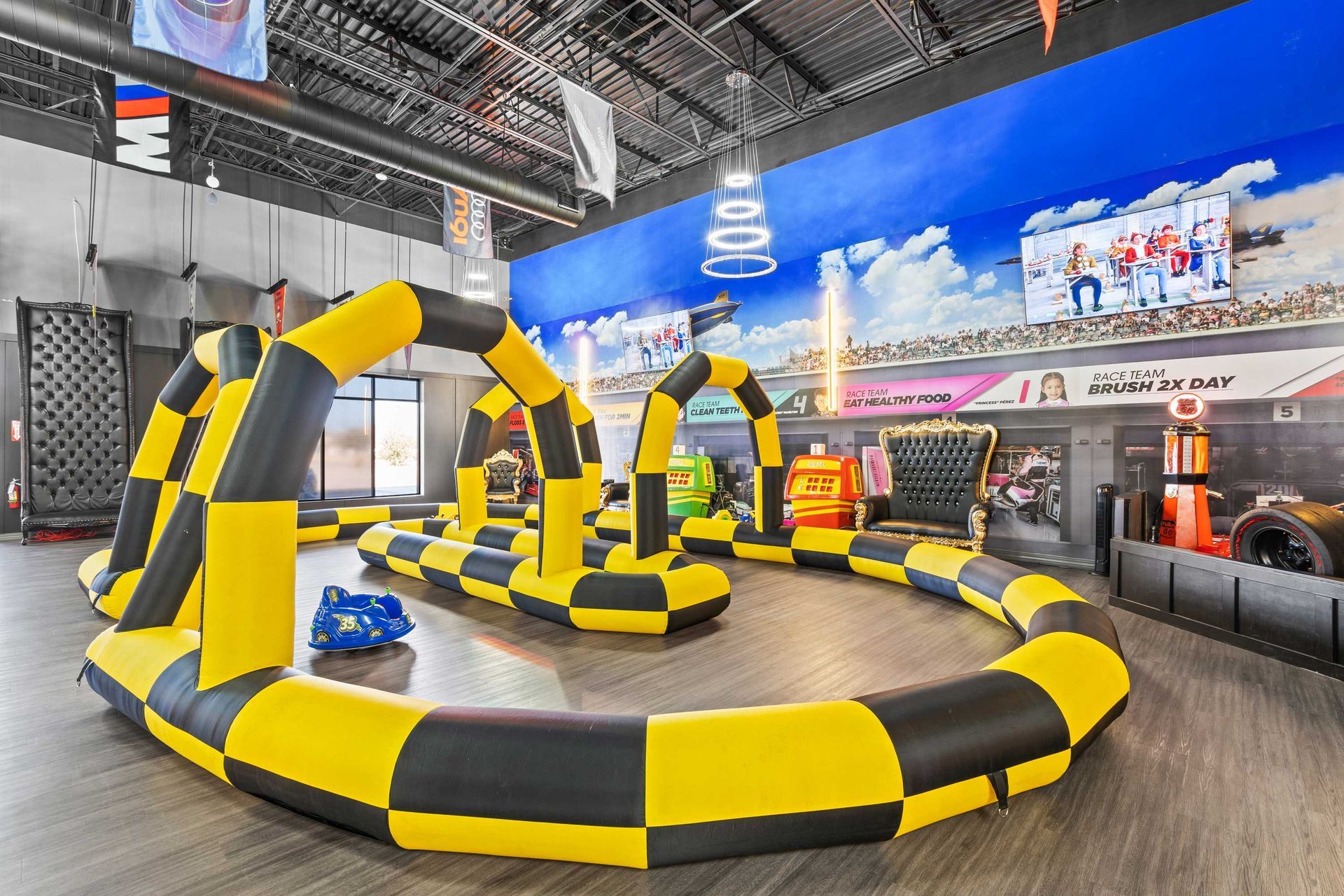 Grand Prix Dental in Katy, TX A yellow and black inflatable race track in a room.