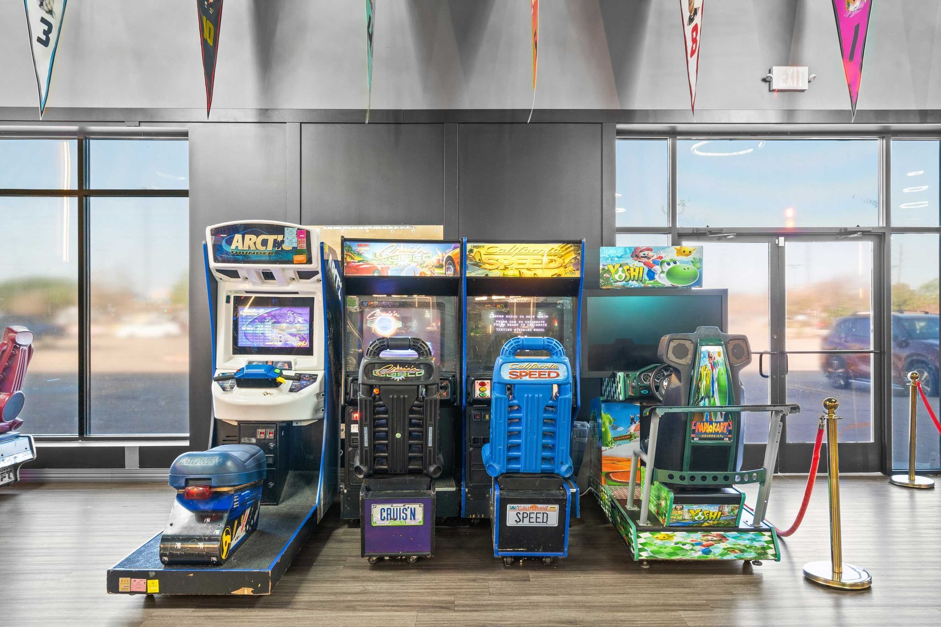Grand Prix Dental in Katy, TX A bunch of arcade games are lined up in a room.