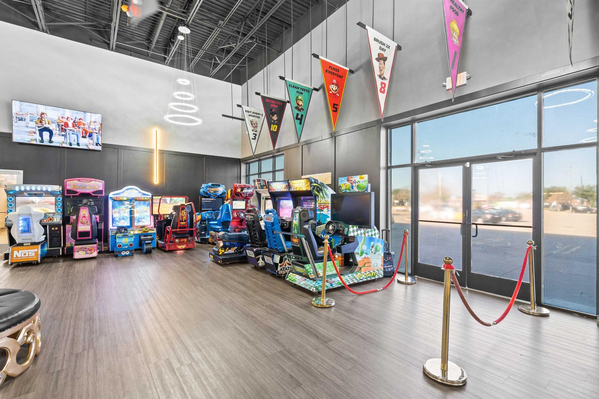 Grand Prix Dental in Katy, TX A large room filled with lots of arcade games.